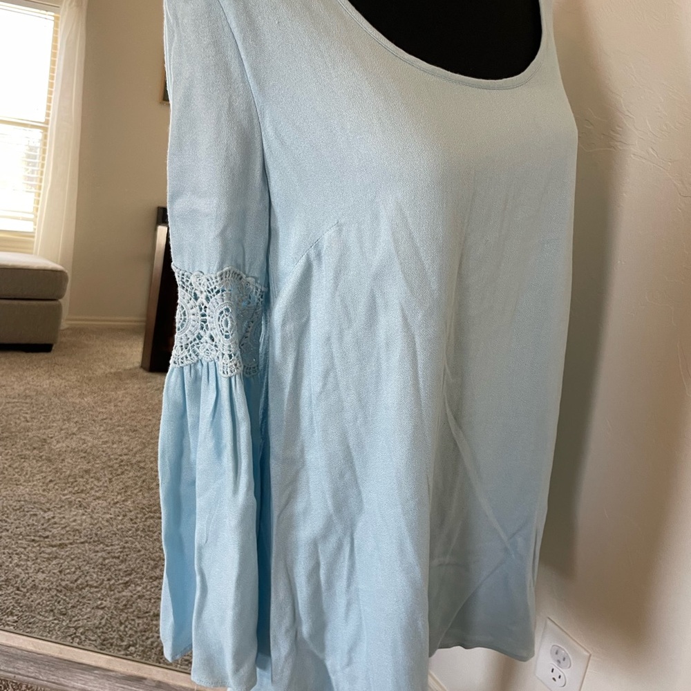 NWOT open back dress with long sleeves. Size medium.